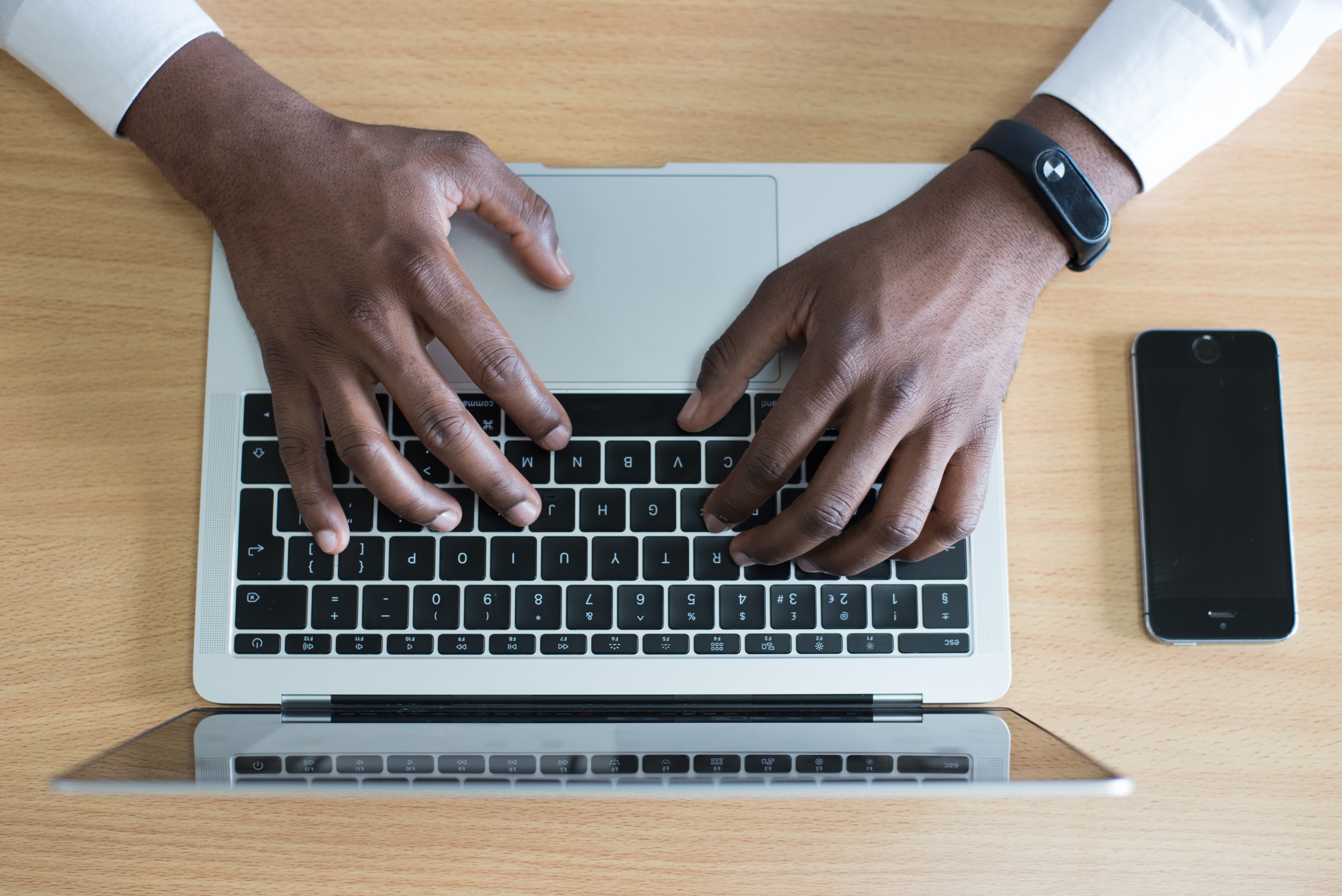 Man typing on a laptop